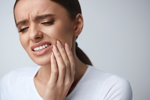 A woman experiencing TMJ pain before trying botox for TMJ